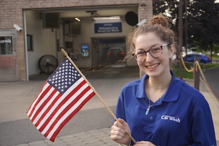 A woman holding an American flag in her hand